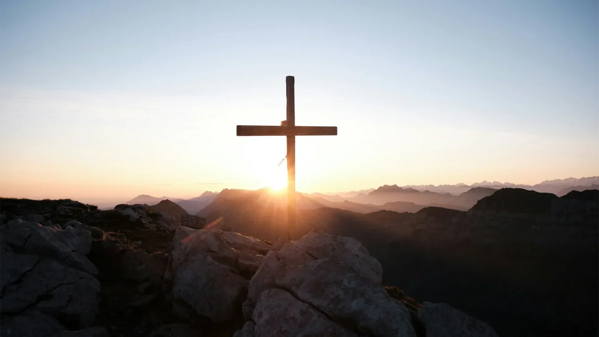 Sunrise behind a cross